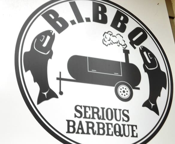 BBQ logo with fish and smoker.