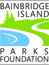 A logo featuring a stylized landscape with a pathway, trees, and water, accompanied by the text "Bainbridge Island Parks Foundation.