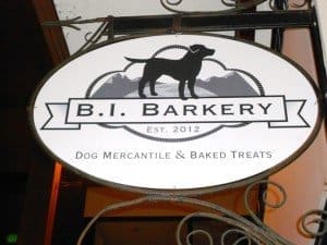 Sign for B.I. Barkery, established in 2012, displaying a silhouette of a dog and text saying "Dog Mercantile & Baked Treats.