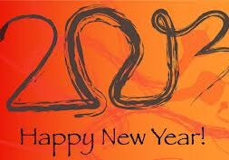 An image with “2013” written in a stylized snake design and the text “Happy New Year!” on an orange background.